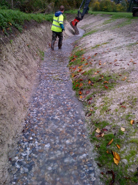 File:151030 Gravels being deposited & spread.jpg